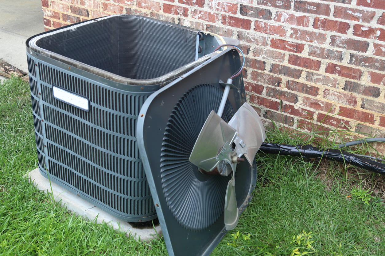 AC condenser unit with fan removed for maintenance