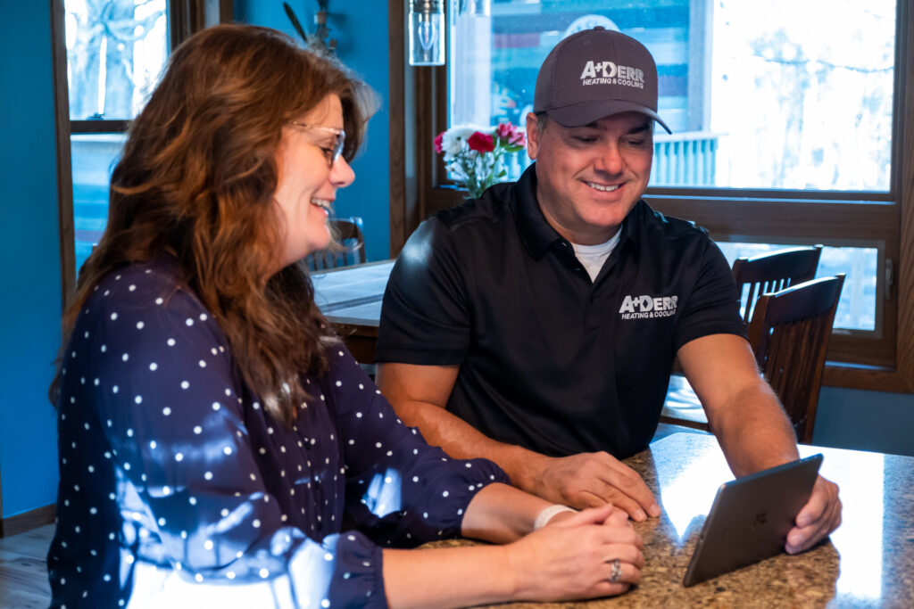 Plumber speaking with customer