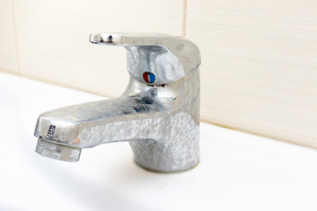 Faucet with scale buildup from hard water